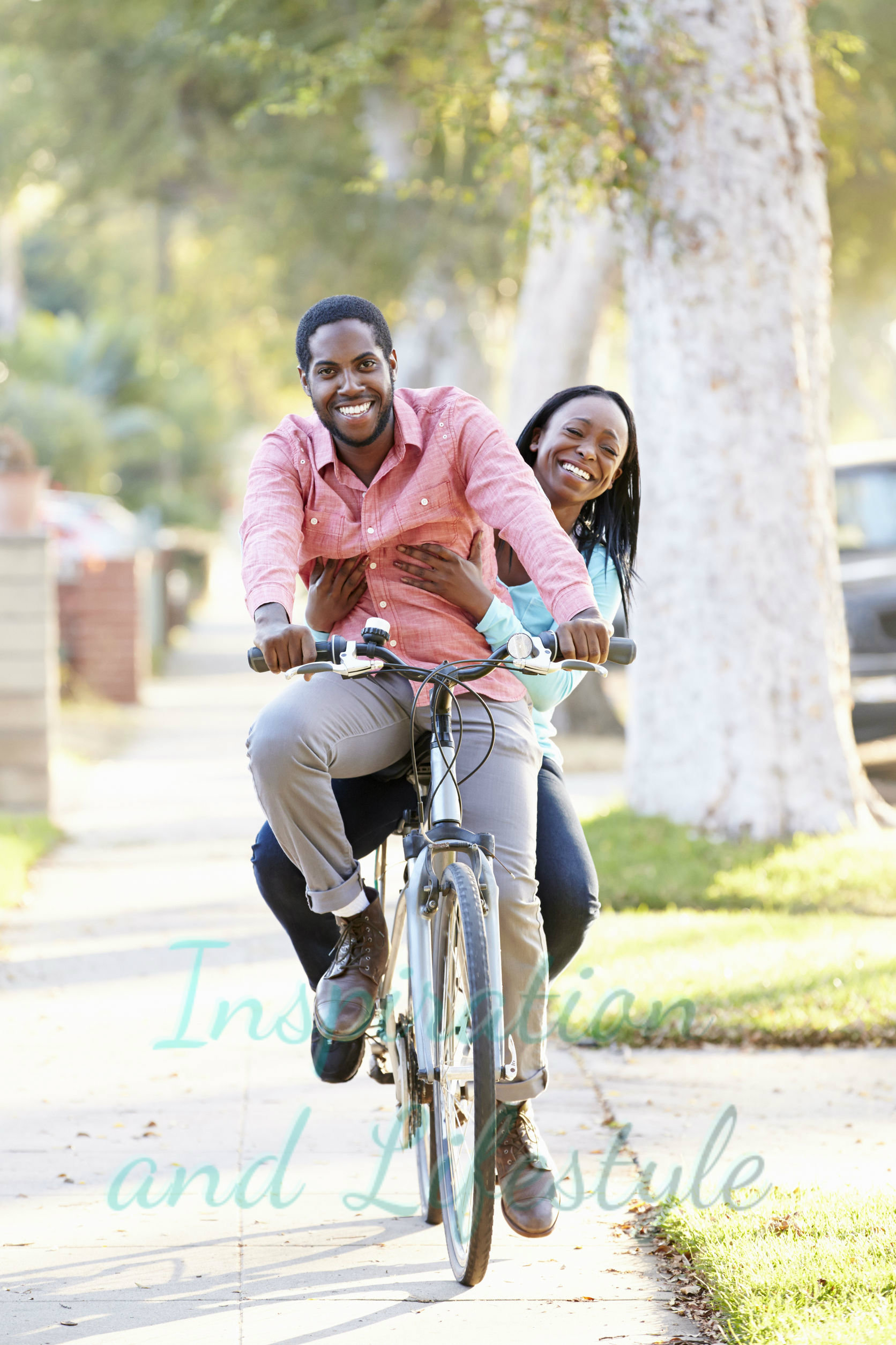 Happy couple riding bicycle